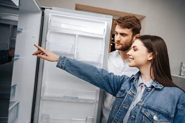 young-couple-selecting-new-refrigerator-household-appliance-store-1-1-600x400jpg - Sam's Appliance Repair Selecting New Refrigerator