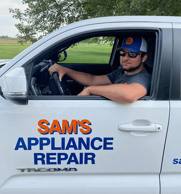 Sam's Appliance Repair owner in truck.